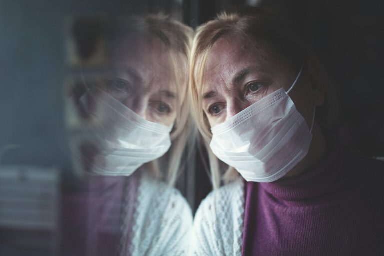 1800x1200_woman-face-mask-at-window.jpg