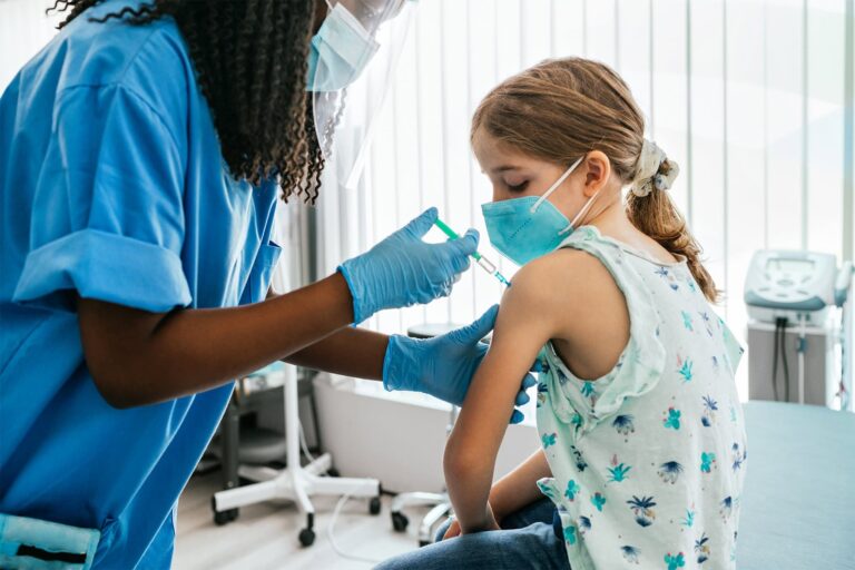 1800x1200_child_receiving_covid_vaccination_one_other.jpg