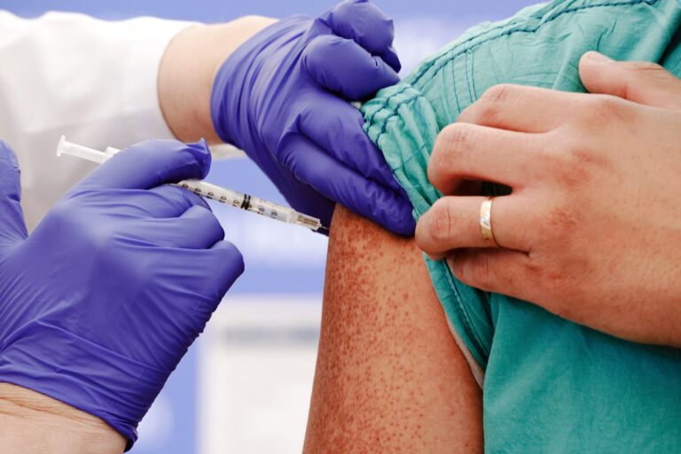 1800ss_getty_rf_healthcare_worker_receives_covid_vaccination.jpg