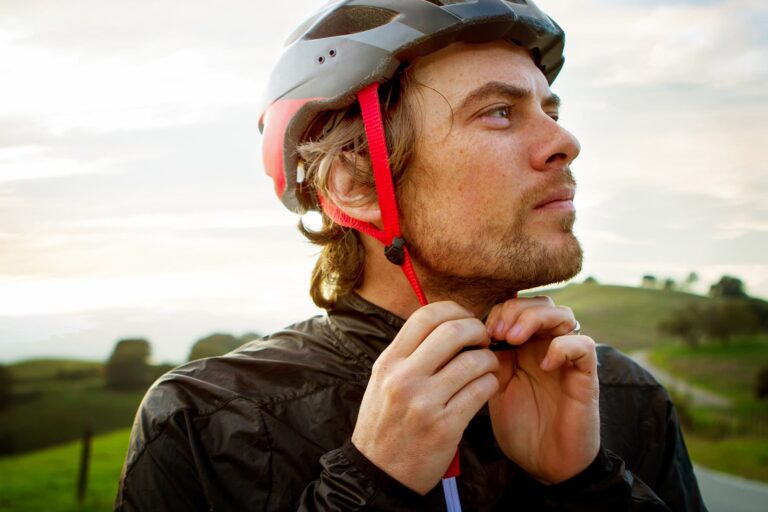 1800ss_getty_rf_man_putting_on_bike_helmet.jpg