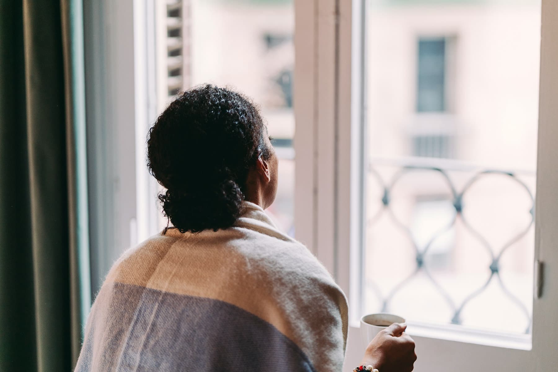 1800x1200_getty_rf_woman_looking_out_window.jpg